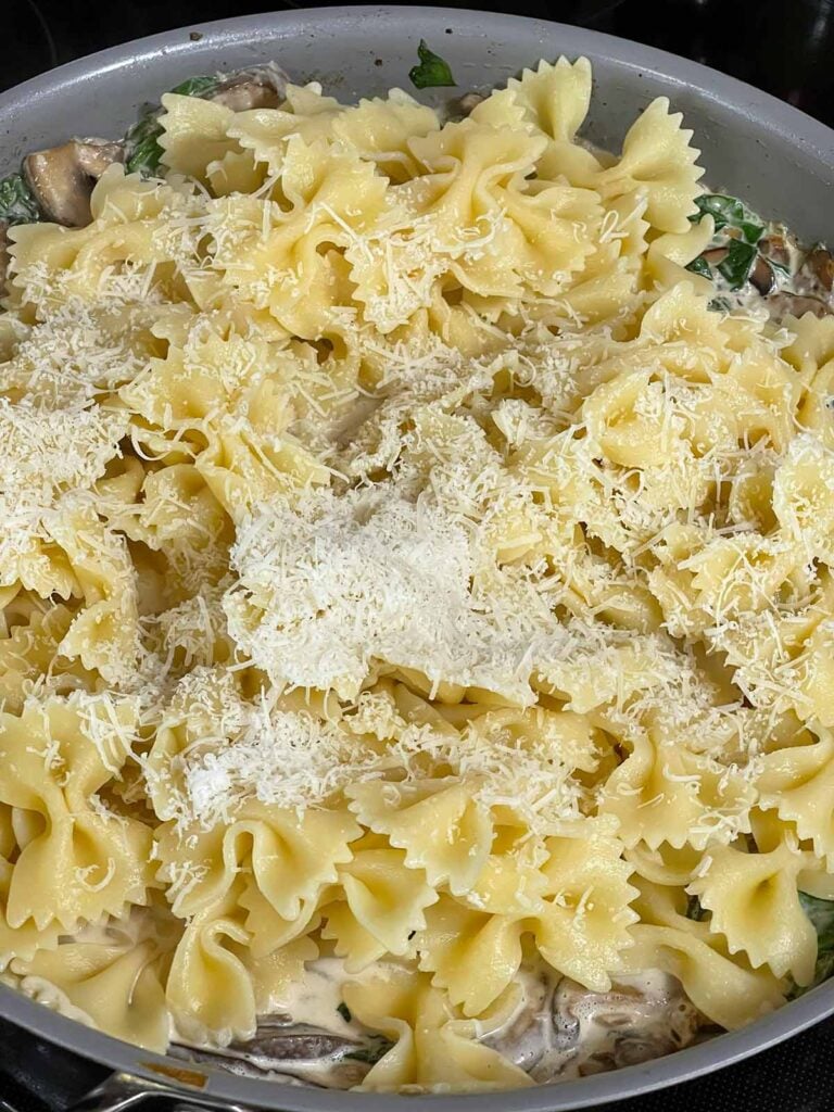 Pasta with Romano cheese in a skillet.