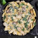 Spinach and Mushroom Pasta in a dark bowl.