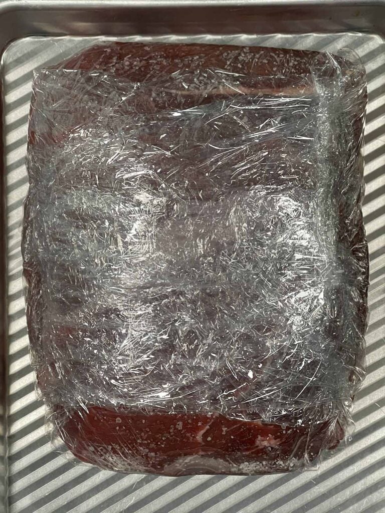 Sirloin tip roast wrapped and resting overnight in the refrigerator during dry brine