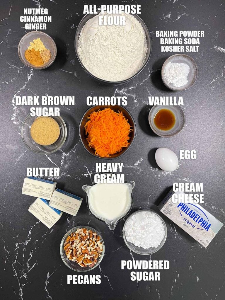 Carrot cake scones recipe ingredients on a dark surface.