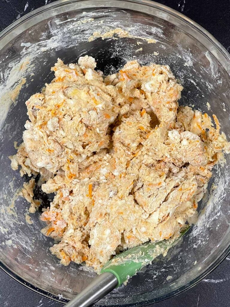 Carrot cake scones dough mixed in a large mixing bowl.
