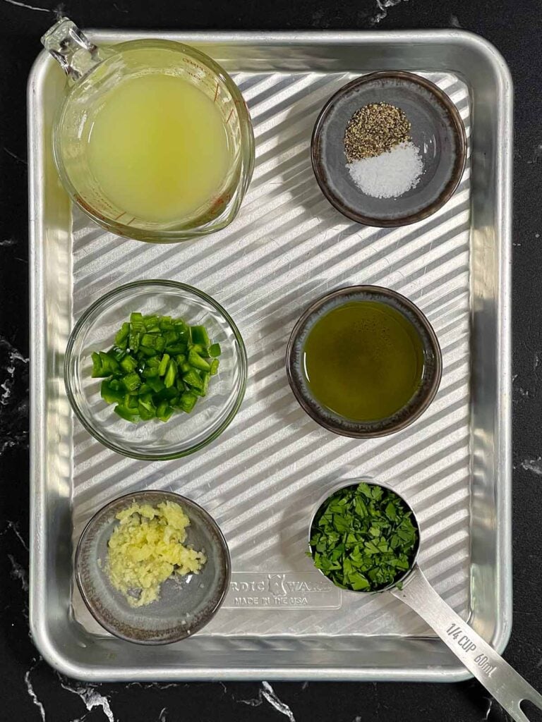 Ingredients for a marinade on a small prep sheet.