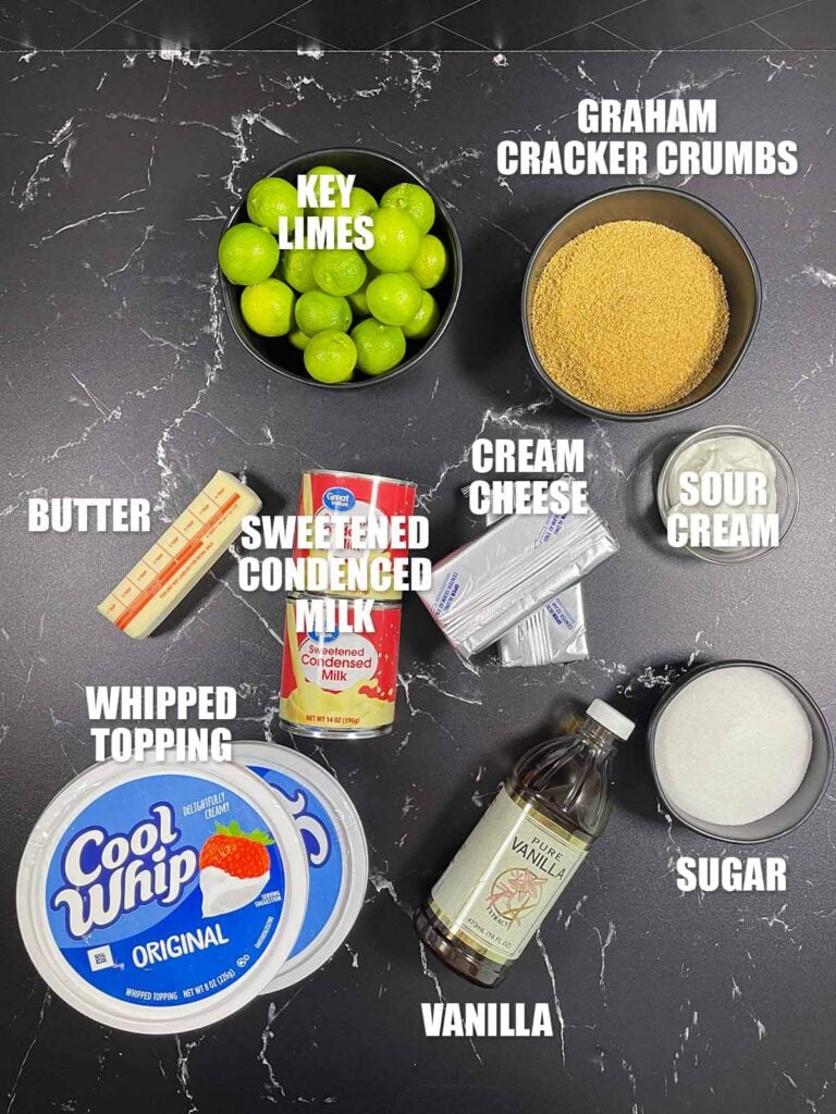 Key lime lush recipe ingredients on a dark surface.