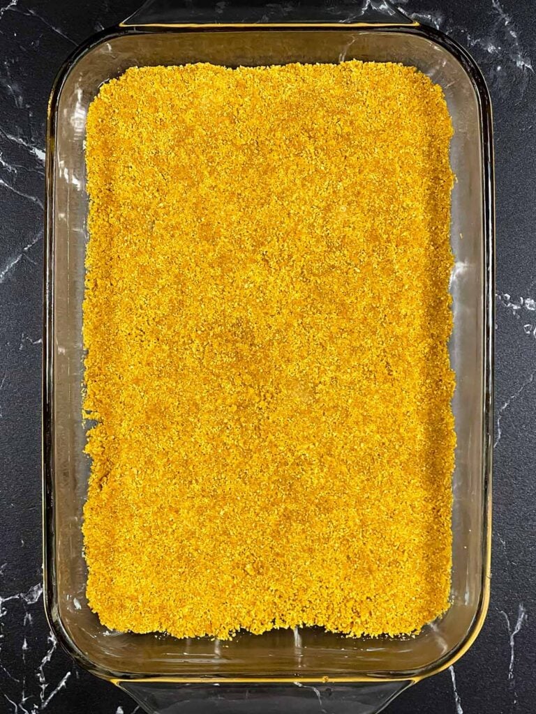 Graham cracker crust pressed into a 9x13 glass baking dish.