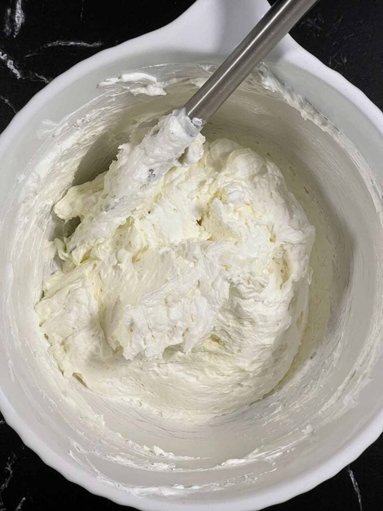 Cream cheese mixture combined in a bowl for the Key Lime lush.