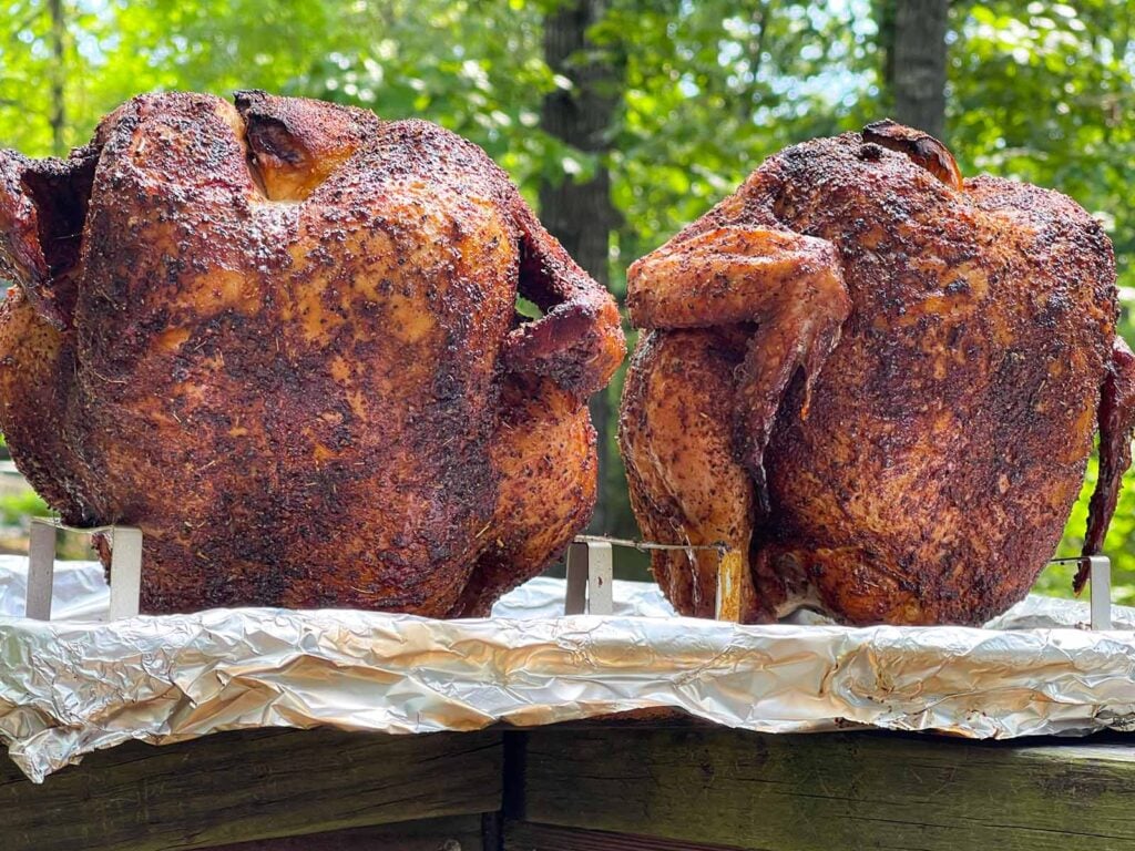 Two smoked beer can chickens just out of the smoker.