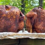 Two smoked beer can chickens just out of the smoker.