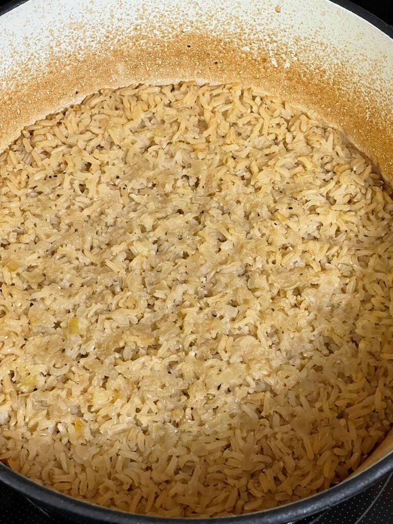 Baked brown rice fully cooked in the Dutch oven.