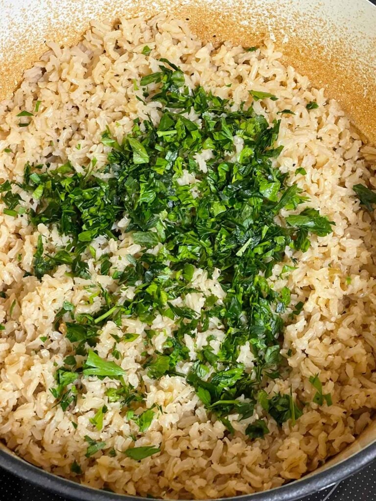 Fresh chopped parsley added to the baked brown rice.