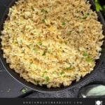 Baked brown rice served in a dark bowl.