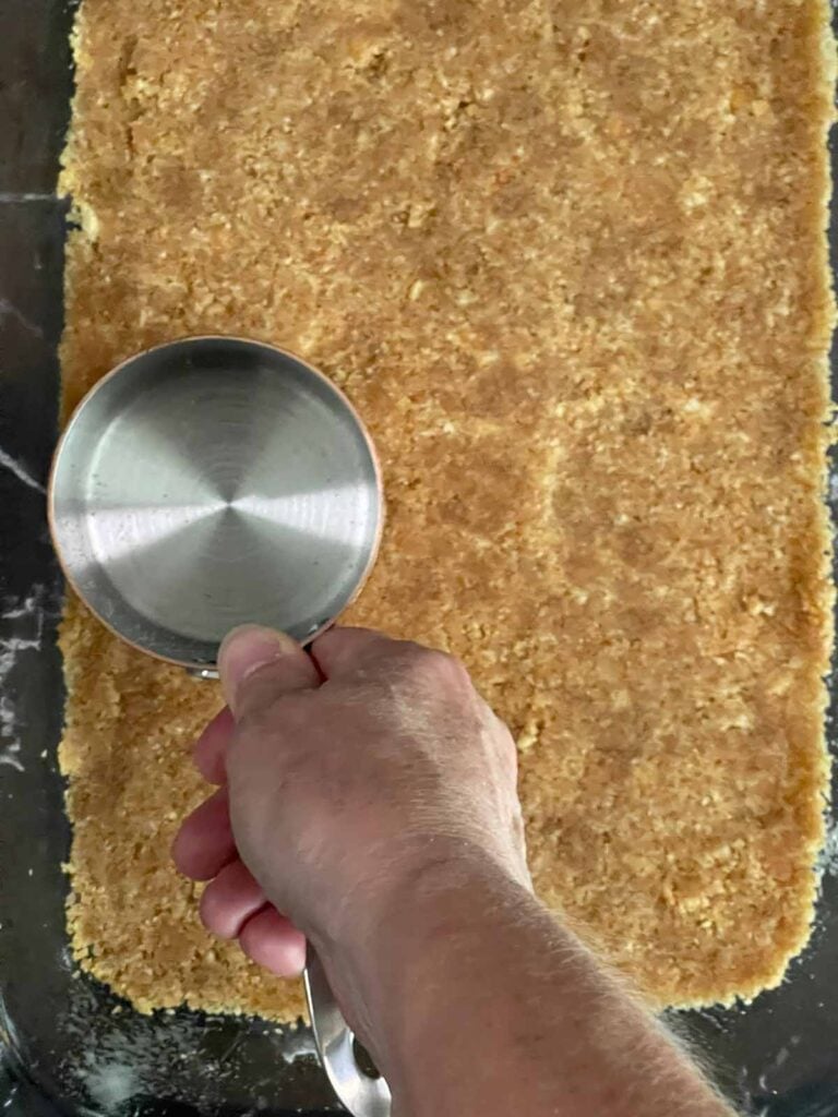 Vanilla wafer crust pressed into a 9x13 glass baking pan.