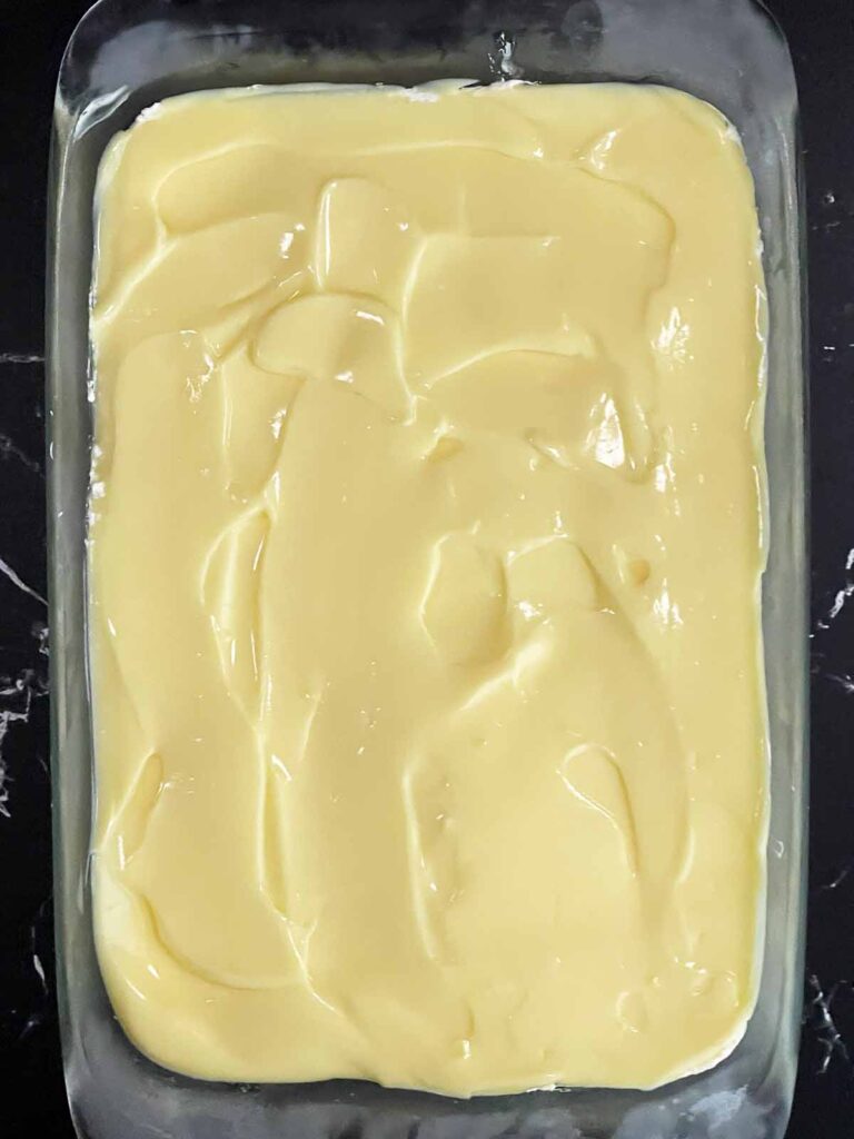 Banana pudding layer spread over the cheesecake layer.