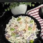 Creamy Classic Coleslaw in a black serving bowl made with coleslaw mix, green onions, and a tangy dill pickle dressing.