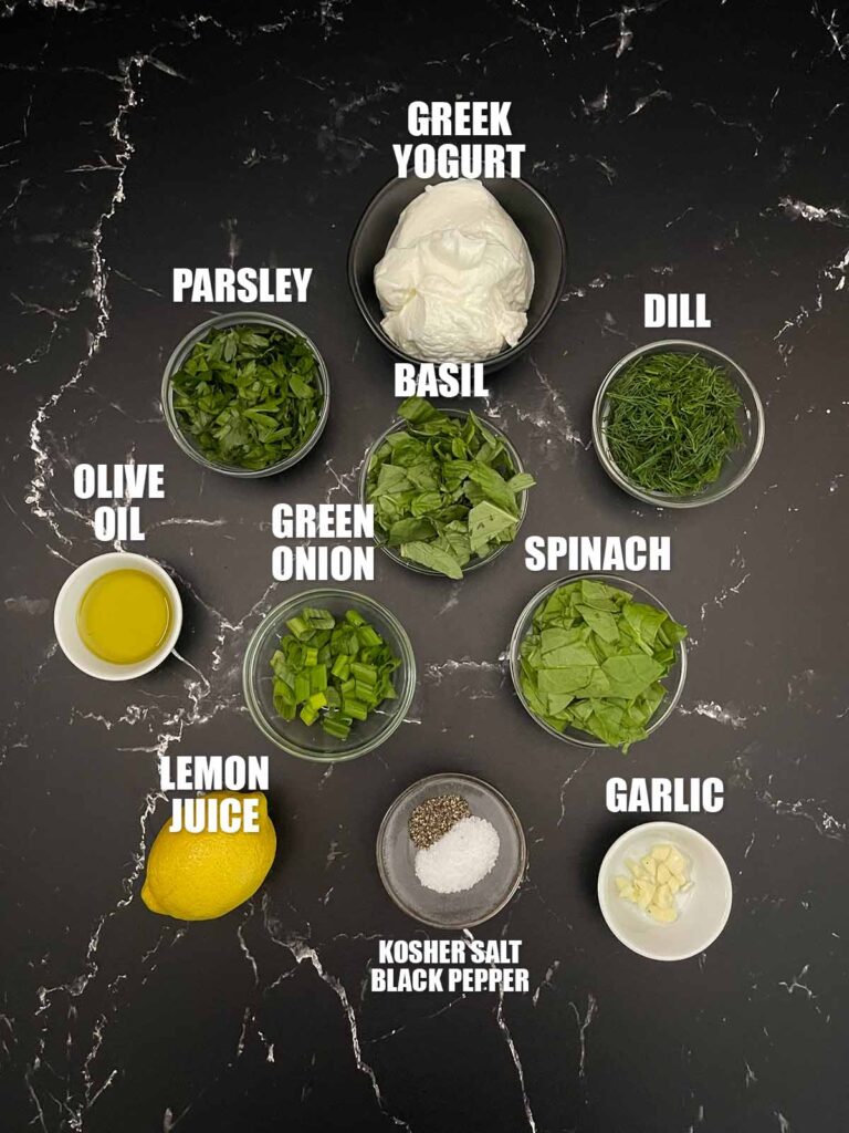 Green Goddess Salad dressing recipe ingredients on a dark surface.