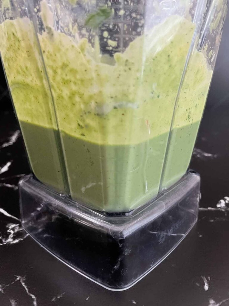 Green Goddess Salad dressing mixed in a blender.