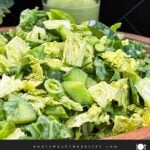 Green Goddess Salad served in a bowl with Napa cabbage, spinach, arugula, cucumbers, snow peas, and creamy herb dressing.