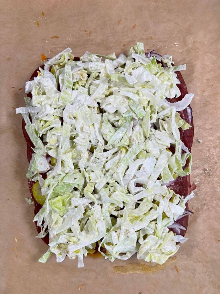 Lettuce going onto some sliders