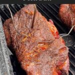 Close-up of smoked boneless pork butt with a deep mahogany bark forming.