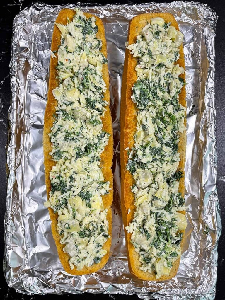 Spinach artichoke mixture stuffed into the toasted French bread.