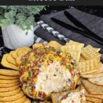 Inside of a Bacon Cheddar Ranch Cheese Ball showing the creamy ranch and cheddar filling with bacon throughout.