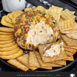 Bacon Cheddar Ranch Cheese Ball recipe made with cream cheese, sharp cheddar, ranch seasoning, bacon, pecans, and green onions.