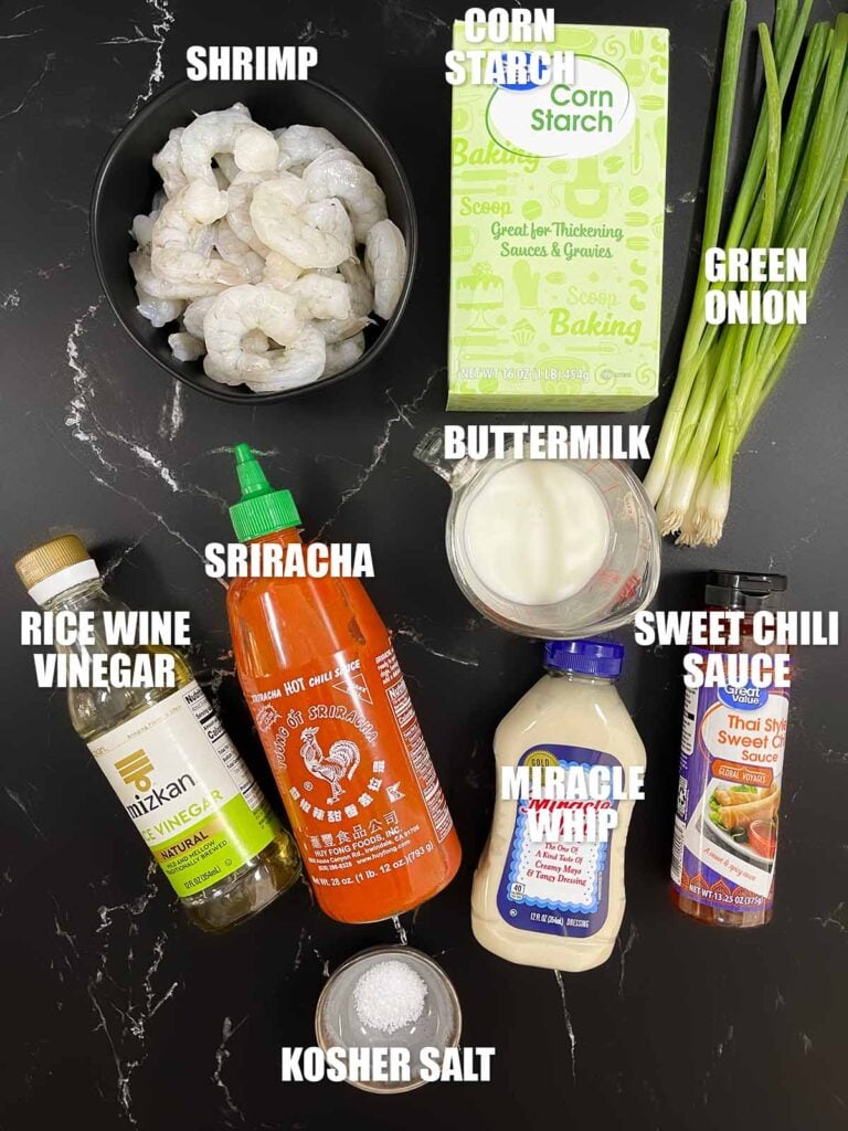 Ingredients for Bang Bang Shrimp, including shrimp, cornstarch, buttermilk, Miracle Whip, sweet chili sauce, sriracha, rice wine vinegar, and green onions.