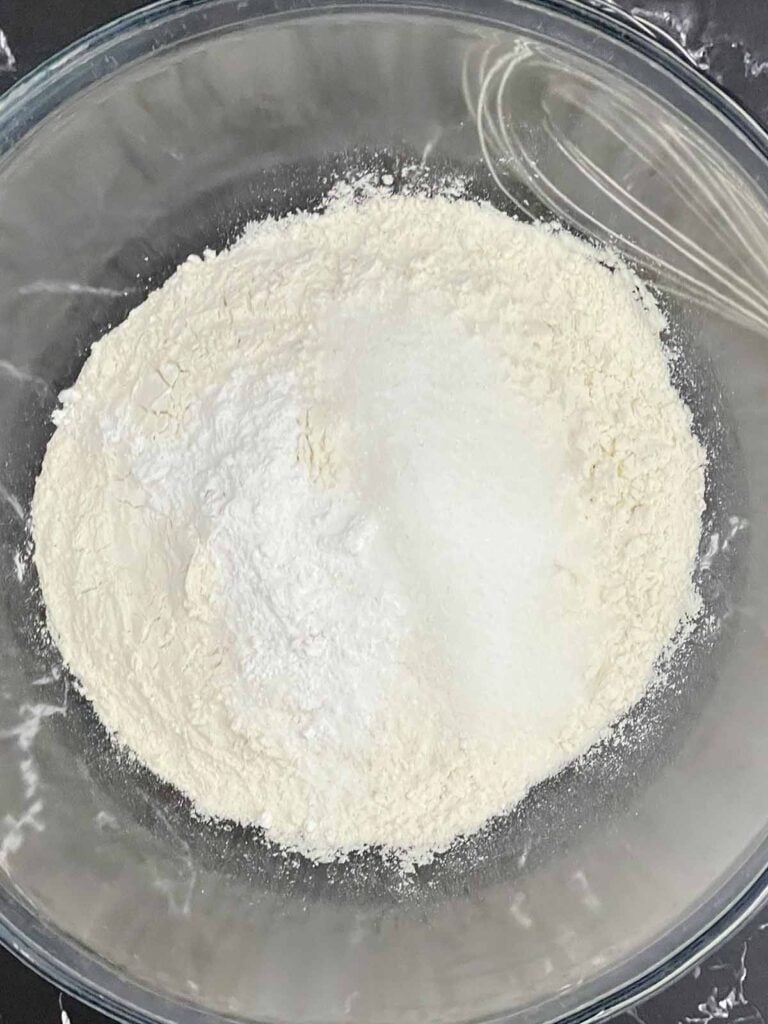 Dry ingredients in a large mixing bowl before adding the butter.