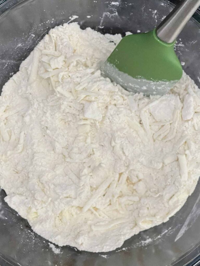 Frozen shredded butter mixed into the flour mixture until evenly coated.