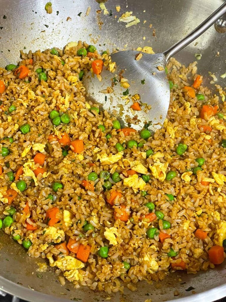 Brown fried rice tossed until evenly coated with the homemade soy sauce mixture.