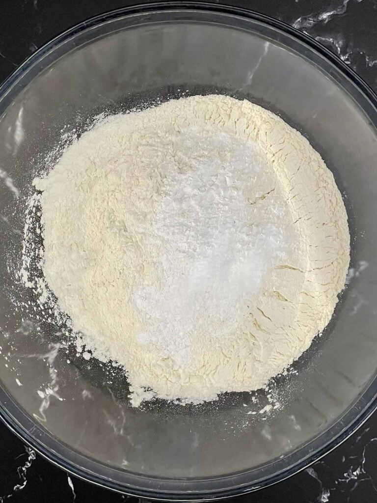 Dry ingredients in a glass mixing bowl.