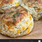 Freshly baked cheddar dill biscuits brushed with garlic dill butter.