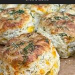 Freshly baked cheddar dill biscuits brushed with garlic dill butter.