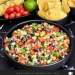 Bowl of Easy Cowboy Caviar served with tortilla chips for dipping.