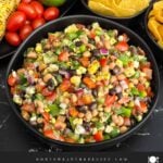 Bowl of Easy Cowboy Caviar served with tortilla chips for dipping.