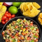 Bowl of Easy Cowboy Caviar served with tortilla chips for dipping.