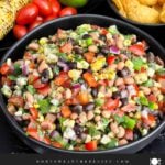 Homemade Cowboy Caviar made with black beans, black-eyed peas, corn, tomatoes, peppers, and cilantro.