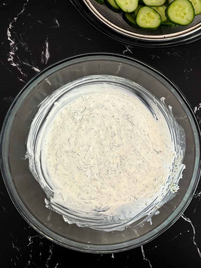 Creamy dill dressing whisked together for creamy cucumber salad.
