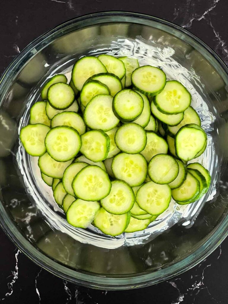 Sliced cucumbers and red onion added to creamy dill dressing.