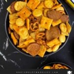 Close-up of crunchy Old Bay Snack Mix made with Corn Chex cereal, pretzels, oyster crackers, and cheddar crackers.