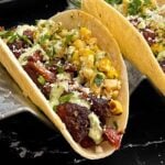 Smoked oxtail tacos in a stand.