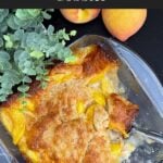 Homemade peach cobbler with a golden buttery crust and juicy peaches fresh from the oven.