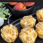 Peach muffins made with fresh peaches, peach preserves, cinnamon streusel, and peach glaze.