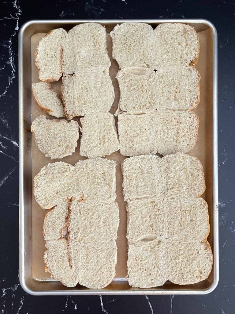 Slider rolls sliced in half with the tops flipped over and ready for assembly.