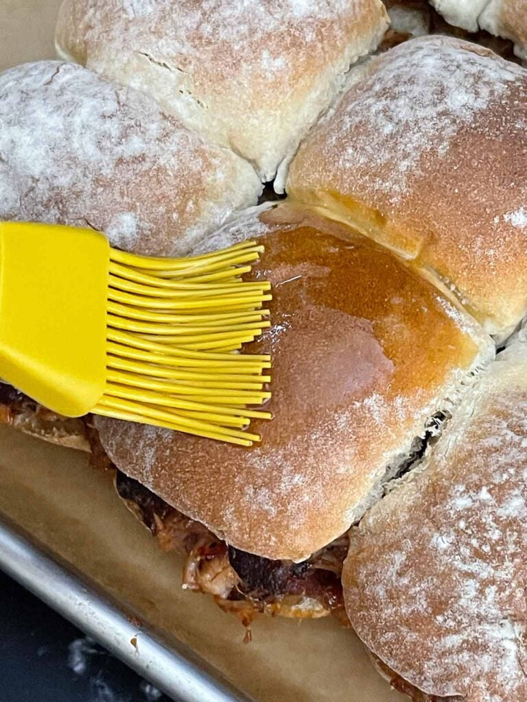 Butter and Worcestershire mixture brushed over the tops of slider rolls before baking.