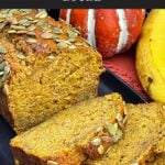 Moist pumpkin banana bread with pumpkin seeds sliced and ready to serve.