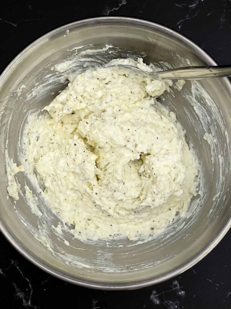 Whole milk ricotta mixed with Pecorino Romano, garlic, Italian seasoning, salt, and black pepper.