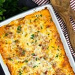 Close-up of baked ricotta chicken with creamy ricotta, marinara sauce, and melted mozzarella cheese.