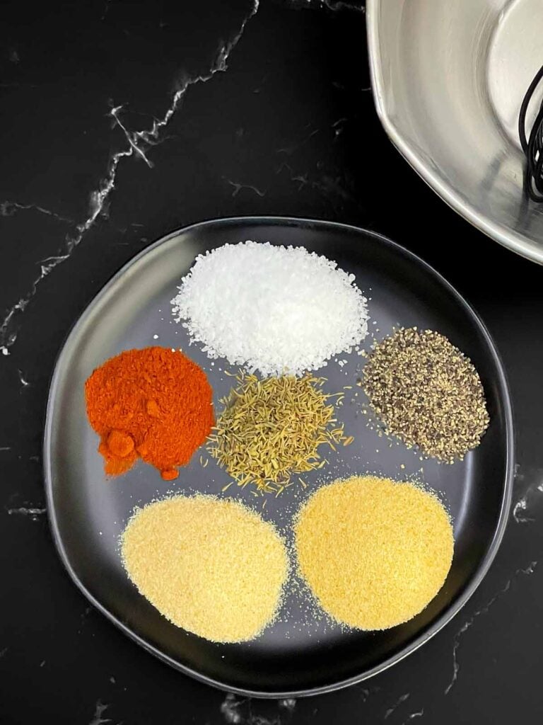 Seasonings for pork tenderloin including kosher salt, black pepper, garlic powder, onion powder, smoked paprika, and thyme.