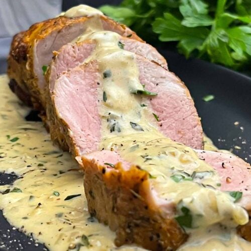Sliced oven baked pork tenderloin topped with creamy Dijon pan sauce.