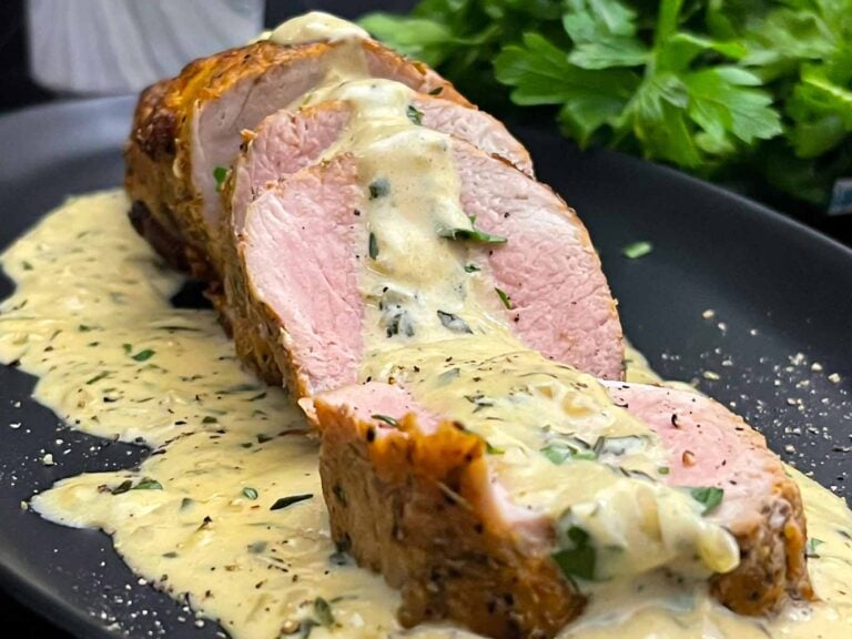 Sliced oven baked pork tenderloin topped with creamy Dijon pan sauce.